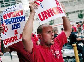 Verizon workers rally in the midst of their strike against concessions