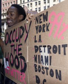 A participator in Occupy Wall Street publicizes the Occupy the Hood twitter feed
