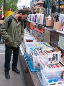 An occupier browses titles at the Occupy Wall Street library