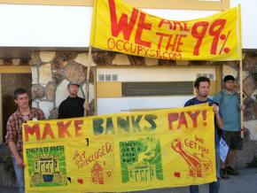 Occupy activists protest in front of a Bayview home in foreclosure