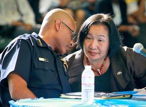 Oakland Mayor Jean Quan confers with Police Chief Howard Jordan