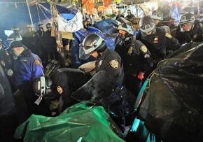 New York City police march through Zuccotti Park destroying the encampment