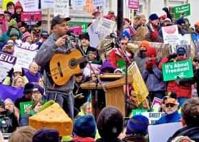 Tom Morello, aka The Nightwatchman, performing before protesters in Madison, Wis.