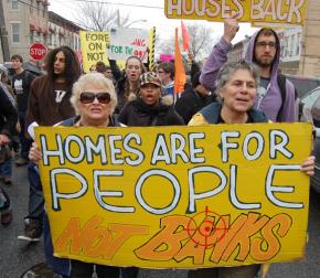 Protesters march through Brooklyn on their way to help a homeless family reclaim a foreclosed home