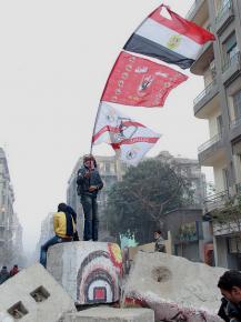 A Zamalek ultra joins in street battles in Cairo during protests about the Port Said massacre