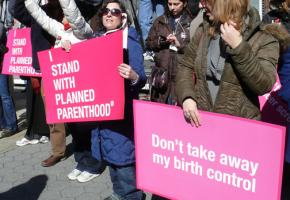 Demonstrating against the right wing's attack on Planned Parenthood