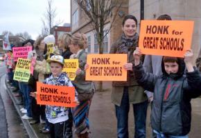 Students and teachers rally to defend public education at a Gresham-Barlow school