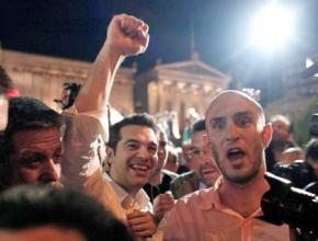 SYRIZA leader Alexis Tsipras (with fist raised) celebrates with supporters on election night