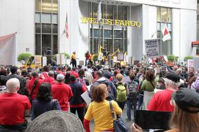 Hundreds march and rally outside a Wells Fargo shareholders meeting