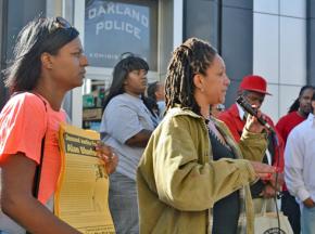 Protesters speak out for justice for Alan Blueford outside an Oakland police station