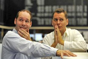 Worried traders on the floor of the Frankfurt Stock Exchange