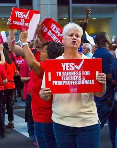 Chicago teachers rally support in the streets during a mass march in May