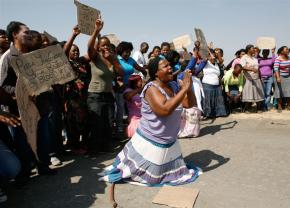 Protesters gather at the Lonmin mine following the massacre of workers by police