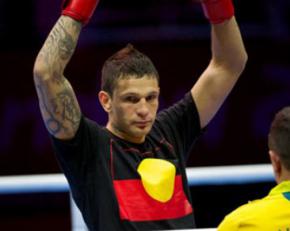 Boxer Damien Hooper wearing a T-shirt bearing the Aboriginal flag