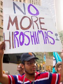 An occupy nukes picketer takes part in protests in New York City