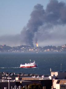 Smoke billows from the fire at a Chevron refinery in Richmond