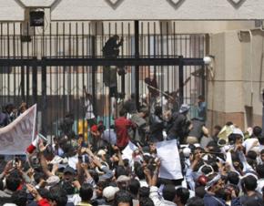 Protesters gather outside the U.S. embassy in Sanaa, Yemen