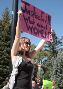 A student protests Justice for All at a Colorado campus