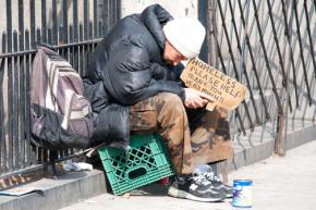 A man left homeless during the housing market crash sits at Broadway and 79th