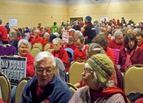 Activists pack an auditorium for the public hearing on the proposed coal terminal