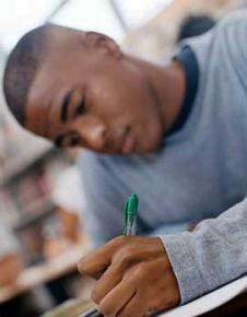 A student works on the GED test