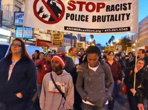 Kevin Clark (second from left) marches with activists against police brutality in the Mission