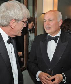 Conservative Party minister Iain Duncan Smith (right) comforts another hapless victim of the poor's avarice