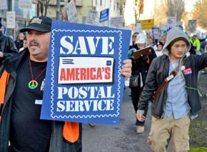 Postal workers march with supporters against cuts to USPS jobs and services