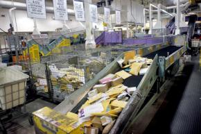 Mail passes through a busy processing center