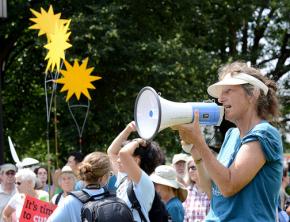 Climate change activists demand Obama block the Keystone XL pipeline at a Summer Heat rally outside the White House