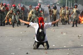 Egyptian army forces confront a protest in Cairo