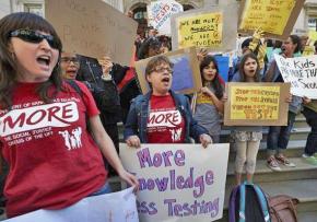 Members of a New York City teachers' union rank-and-file caucus rally against testing