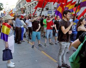 Supporters of Podemos join in a rally against the Spanish monarchy