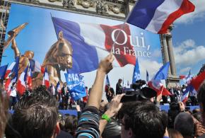 Supporters of the National Front rally during a speech by Marine Le Pen