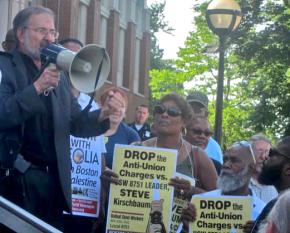 Supporters surround union activist Steve Kirshbaum at a solidarity protest