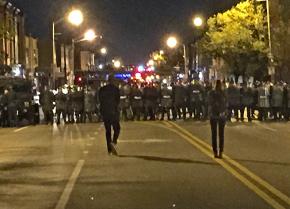 A line of riot police in Baltimore after curfew