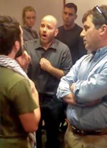 UT professor Ami Pedhazur (center, speaking) confronts a student (left) speaking on behalf of the Palestine Solidarity Committee