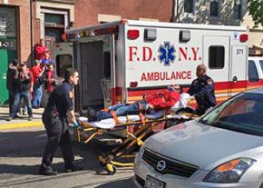 A Verizon striker, injured by a New York City police officer driving a scab truck, is taken to the hospital