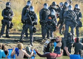 Police crack down on peaceful water protectors with rubber bullets and pepper spray