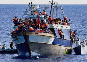 An Italian naval vessel intercepts refugees from sub-Saharan Africa