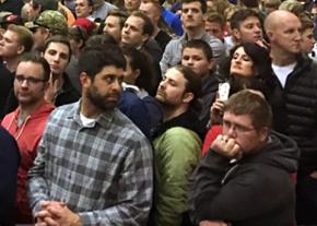 Trump supporters wait for their candidate to speak at a Michigan rally