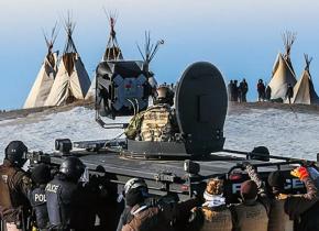 A militarized police unit prepares to arrest dozens of water protectors at Standing Rock, North Dakota