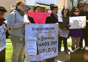 Activists protest an anti-immigrant lawsuit outside the home of New York State Assembly member Nicole Malliotakis