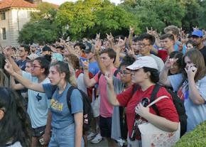 Thousands attend a vigil for slain student Harrison Brown at UT Austin