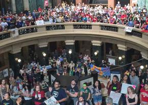 Protesters rally in the Wisconsin state Capitol building to defend DACA