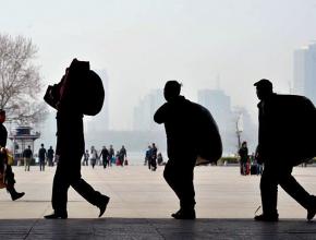 Commuting workers arrive at the outskirts of Beijing