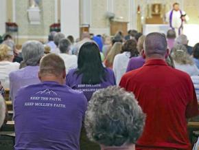 Mourners attend a church service for Mollie Tibbetts in Brooklyn, Iowa