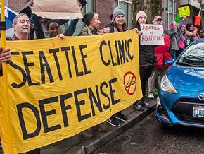 Members of Seattle Clinic Defense stand up against the right at Planned Parenthood