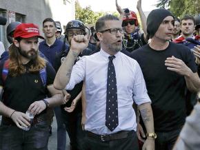 Proud Boys founder Gavin McInnes (center) leads a march of the far right