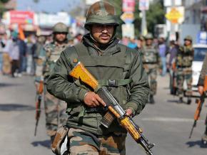 Indian troops enforce a curfew in occupied Kashmir